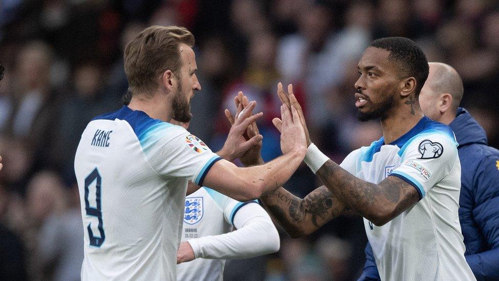 Ivan Toney high fives Harry Kane as he enters the field for his England debut at Wembley Stadium