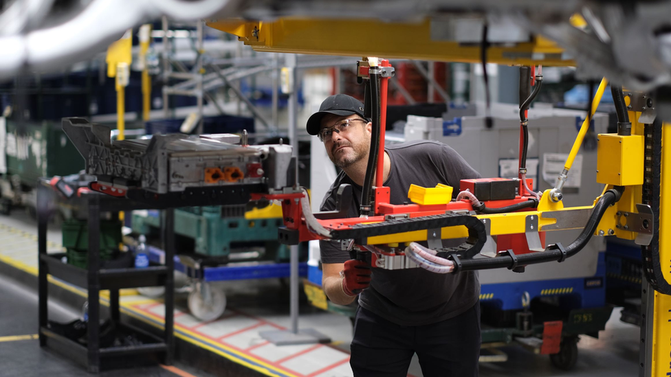 Man working on electric car