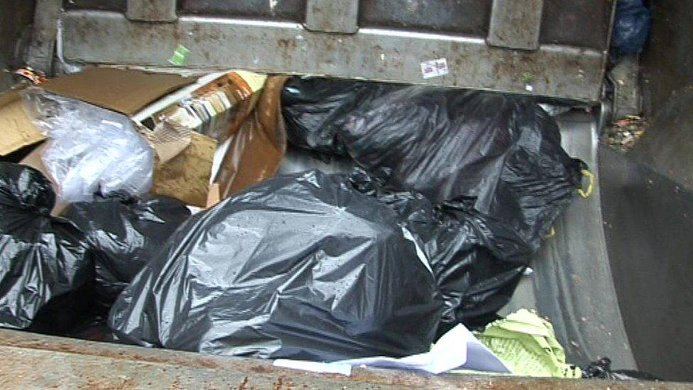 Rubbish in back of bin lorry