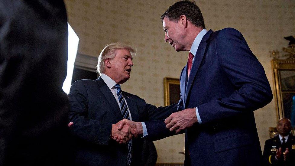 US President Donald Trump shakes hands with James Comey, director of the Federal Bureau of Investigation