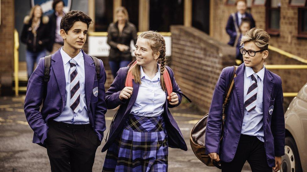 three-children-leaving-school