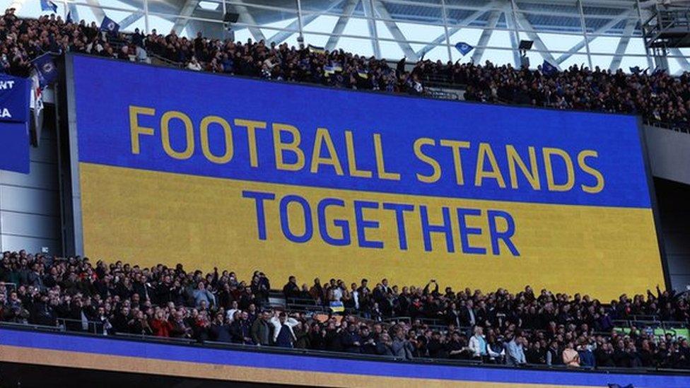 A screen saying Football Stands Together at Wembley in a show of support for Ukraine before the Carabao Cup final