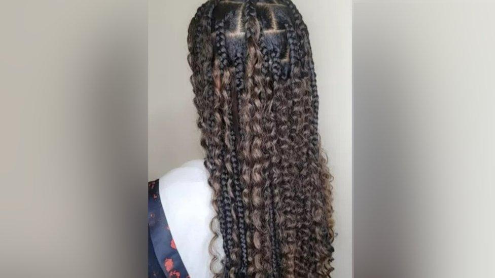 Mayla's hairstyle in 2022 - she has long braids but no colour