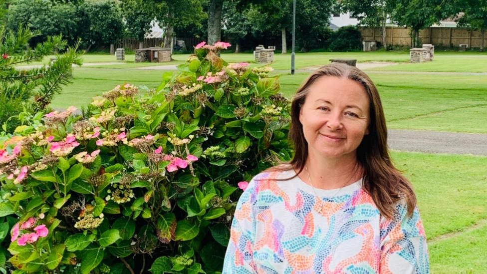 Trencreek Holiday Park owner Julliette Hautot sits in her grassy holiday park