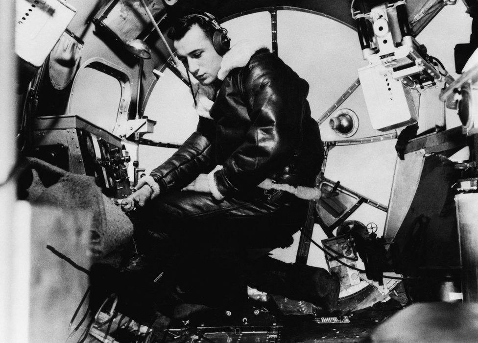 Bombardier, Lieutenant Harry Erickson of the 97th Bomb Group, in the nose of a B-17 Flying Fortress, July 1942