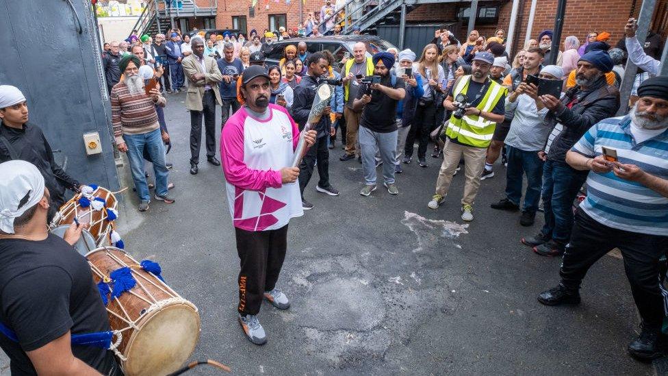 Ranjit Singh takes part in The Queen's Baton Relay as it visits Wolverhampton