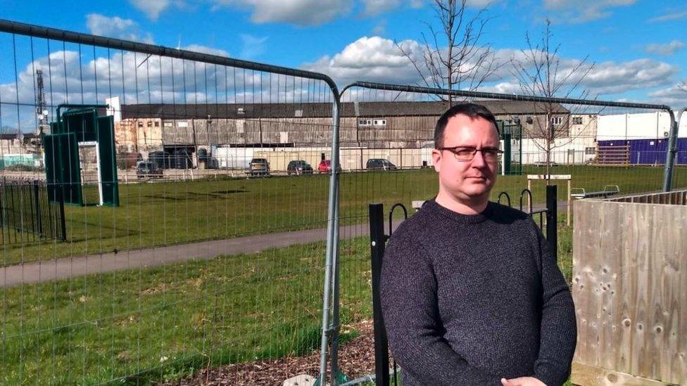 Councillor Daniel Adams near the construction site