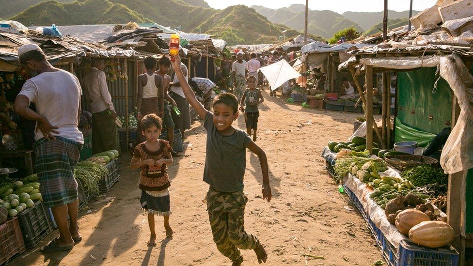 Children flying kites in a camp in Cox's Bazar