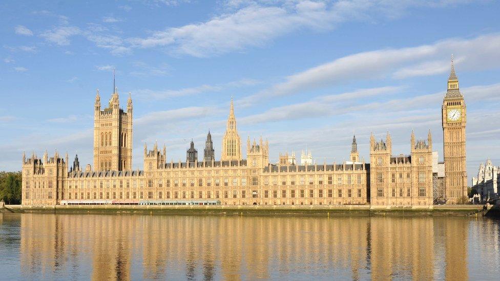 The Houses of Parliament, London, illuminated by the morning sun,