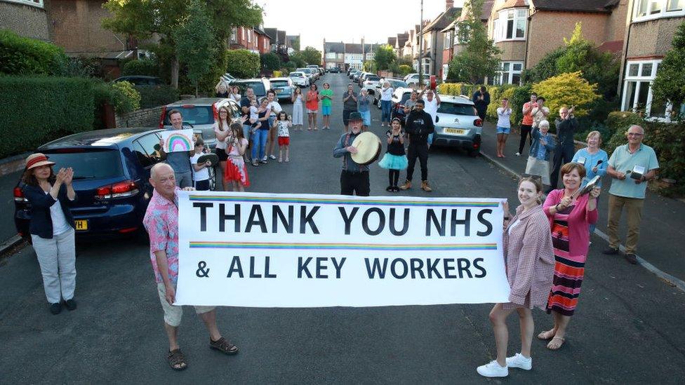 people-with-thank-you-sign.