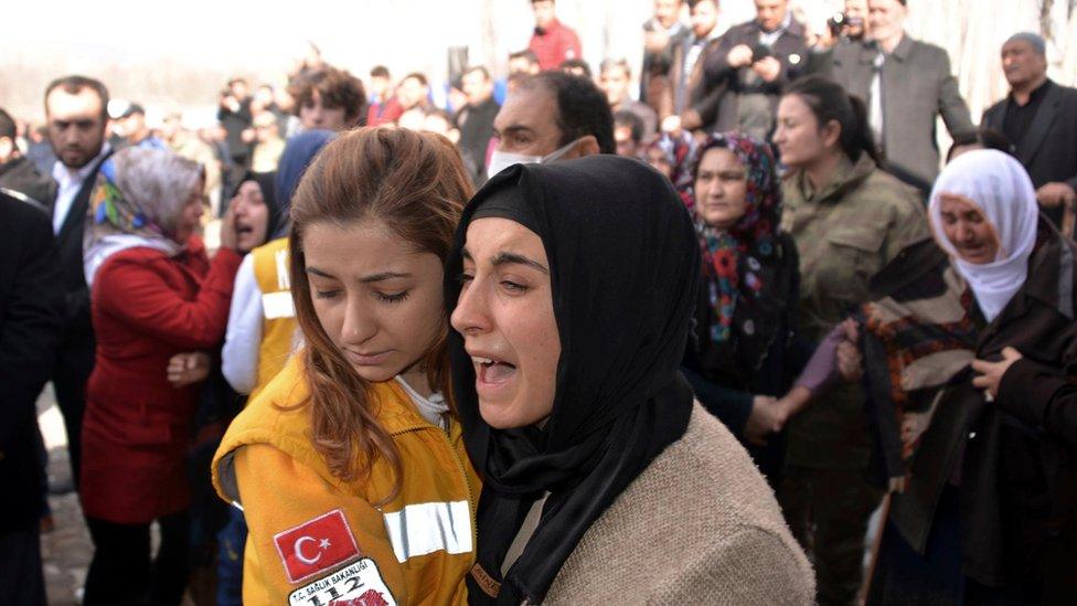 Family of a Turkish soldier killed in a Russian air strike in northern Syria at a funeral in Elbistan, Turkey (10 February 2017)