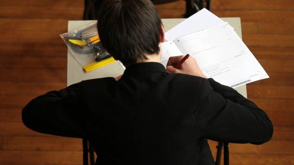 Boy sitting a test at a desk