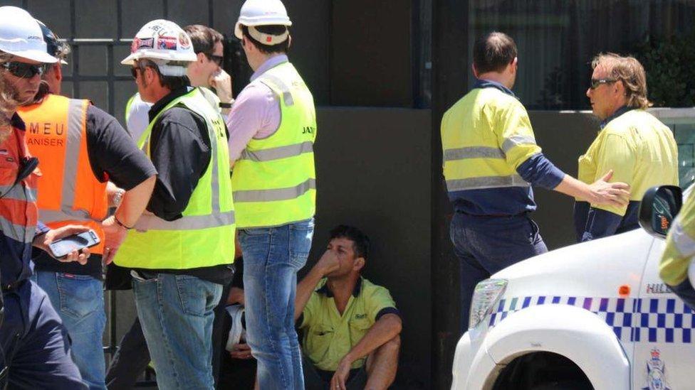 Colleagues of construction workers pictured after accident