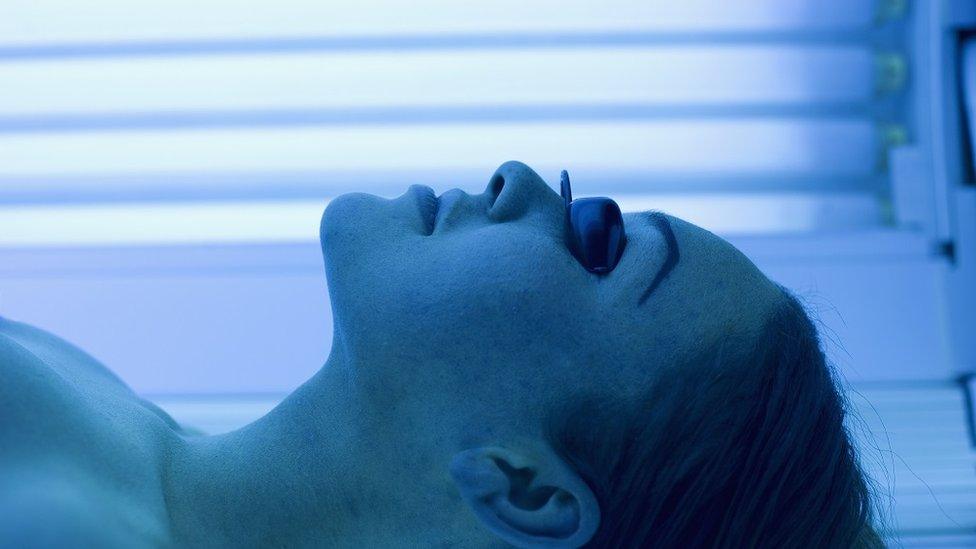 Woman on a sunbed