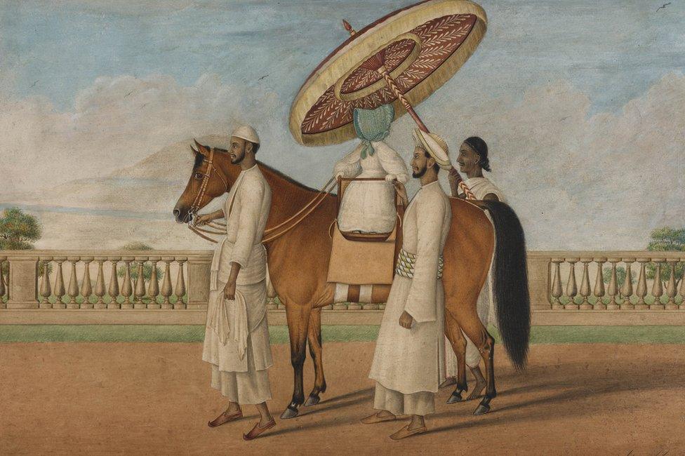 English child seated on a pony and surrounded by three Indian servants, 1830-1850