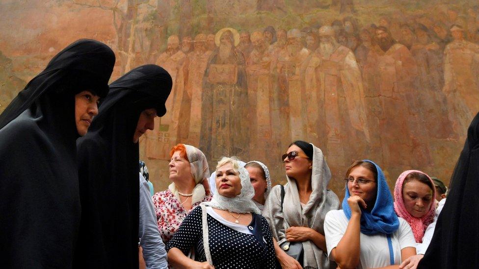 Believers of the Ukrainian Orthodox Church (Moscow patriarchy) take part in a religious procession in Kiev on 27 July 2018