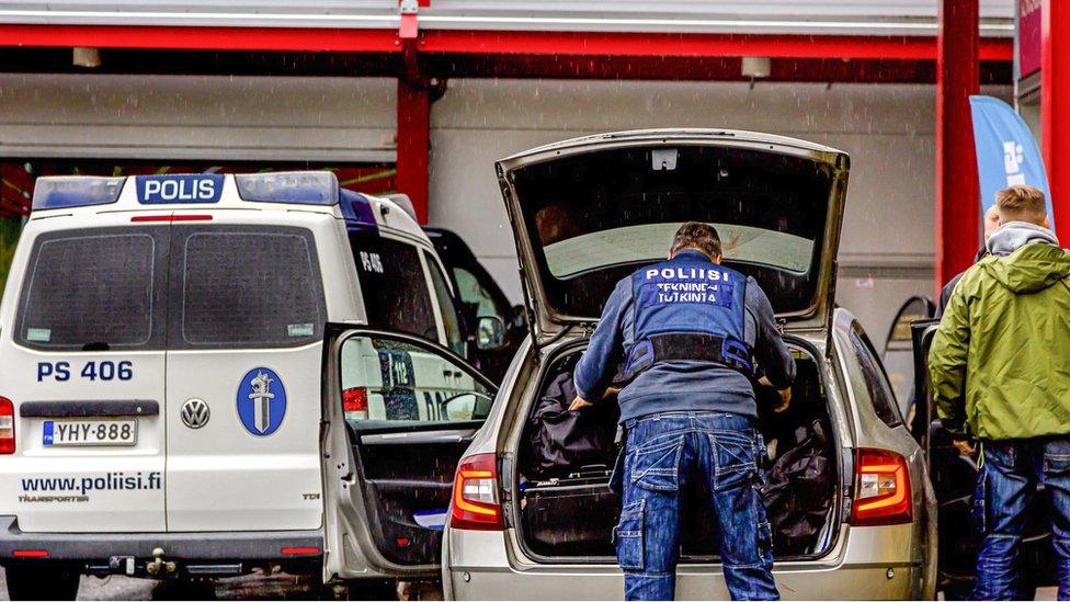 Police investigators outside the Herman Mall in Kuopio, Finland, 1 October 2019