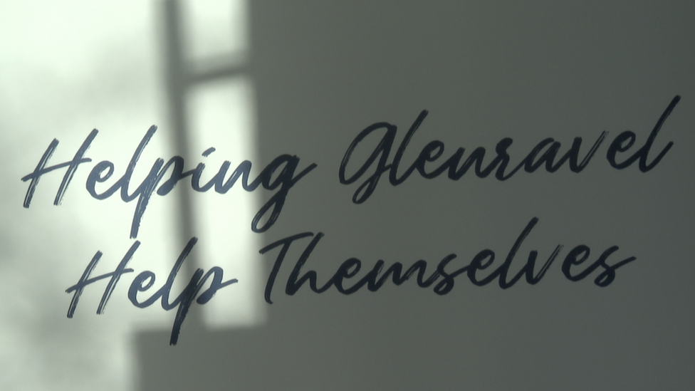 A sign that reads: Helping Glenravel Help Themselves