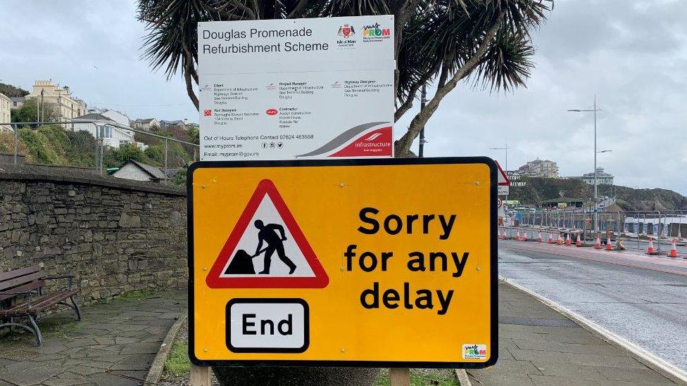 DOI road works sign apologising for "any delay"