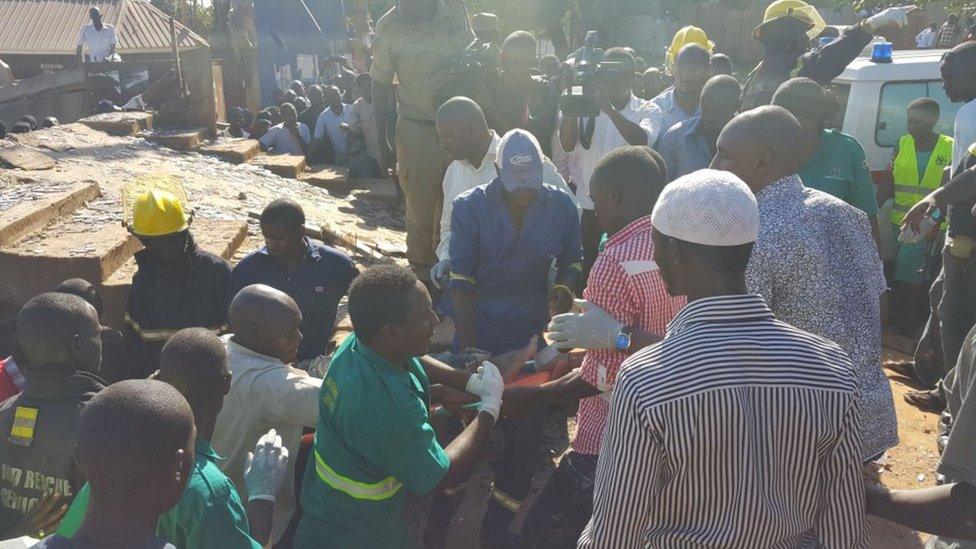 Person being rescued from building in Kampala