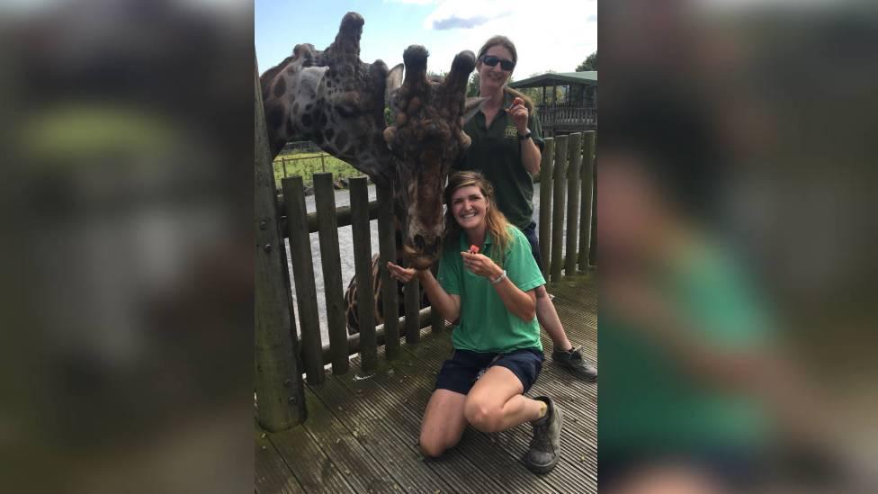 Folly Farm staff with a giraffe