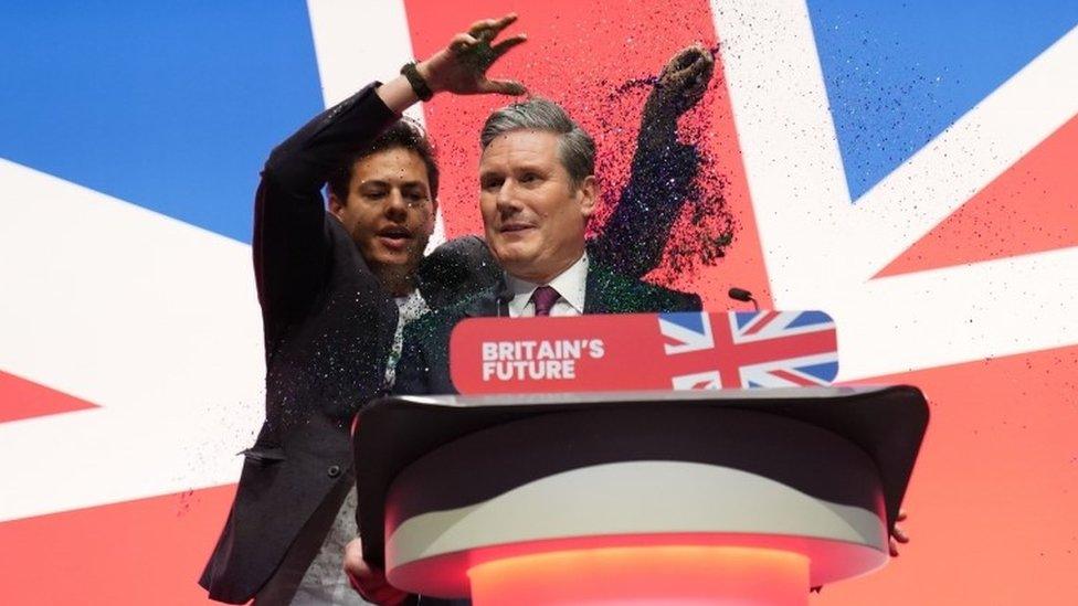 Keir Starmer and a protester