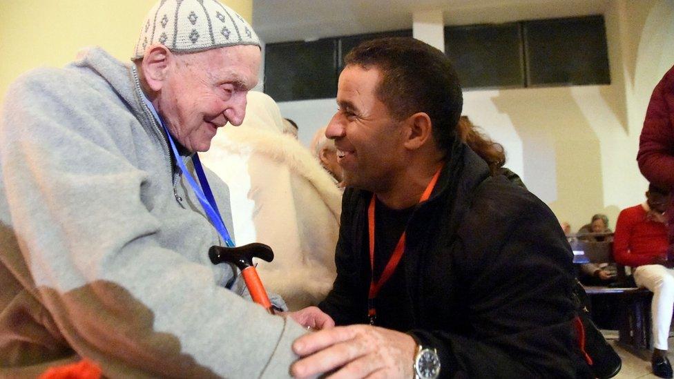 Jean-Pierre Schumacher (L), the last survivor of the monks hostage taking, at the ceremony