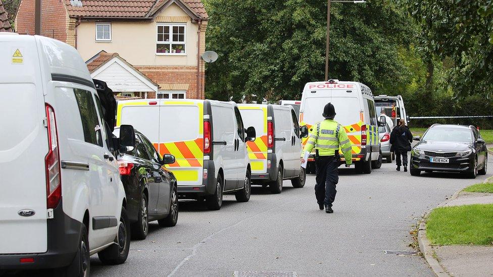 Police vehicles at the scene of the Milton Keynes stabbings