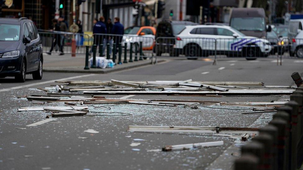 Debris is spread across a road near a partially collapsed building in Brussels, 9 February 2020