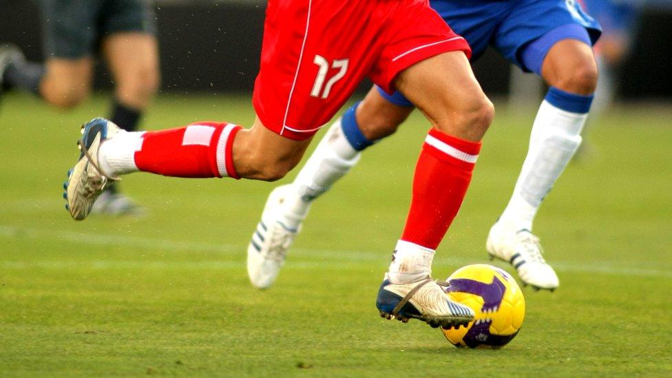 Two football players on the pitch