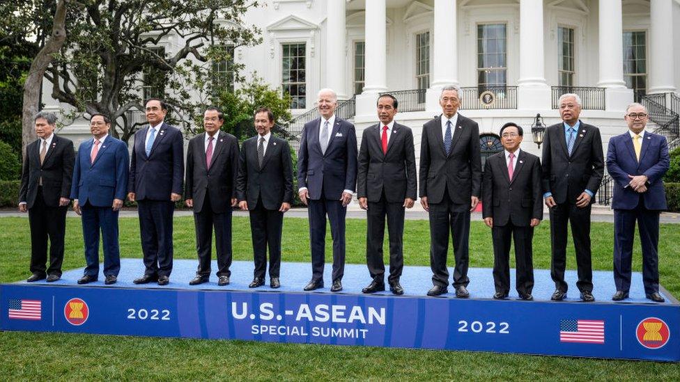 U.S. President Joe Biden (C) with (L-R)Dato Lim Jock Hoi, Prime Minister of Vietnam Pham Minh Chinh, Prime Minister of Thailand Prayut Chan-o-cha, Prime Minister of Cambodia Hun Sen, Sultan of Brunei Haji Hassan, President of Indonesia Joko Widodo, Prime Minister of Singapore Lee Hsien Long, Prime Minister of the Lao Peoples Democratic Republic Phankham Viphavan, Prime Minister of Malaysia Dato Sri Ismail Sabri bin Yaakob and Secretary of Foreign Affairs of the Philippines Teodoro Locsin.