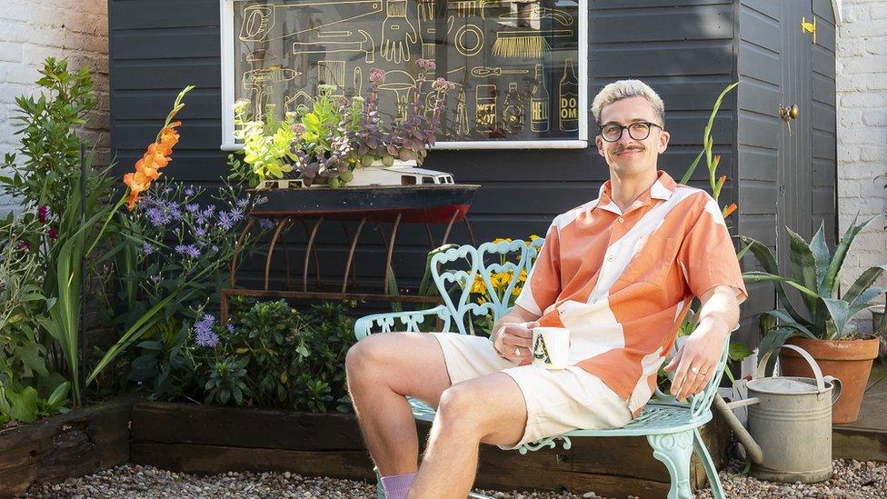 Archie Proudfoot sits in front of his winning shed