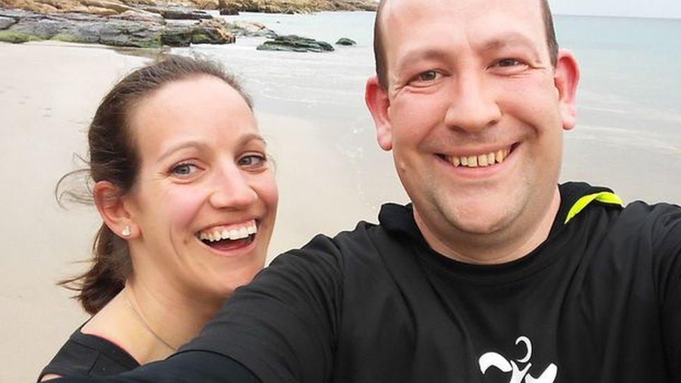 Chris Rose and his wife Angela on a beach