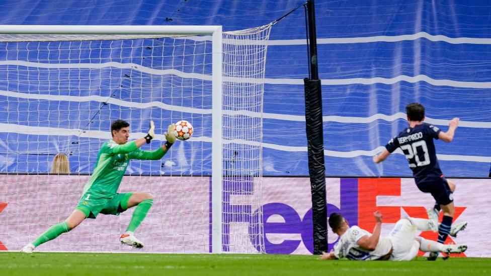 Thibaut Courtois making a save