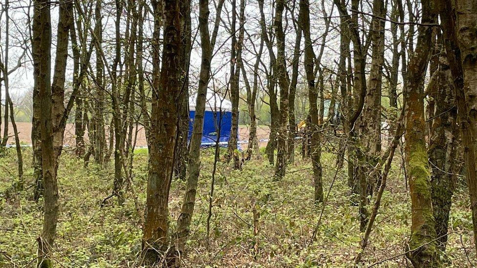 Police tent in a field