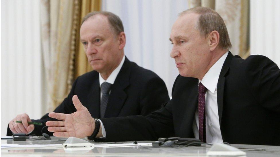 Russian President Vladimir Putin, right, accompanied by Security Council Secretary Nikolai Patrushev in 2015