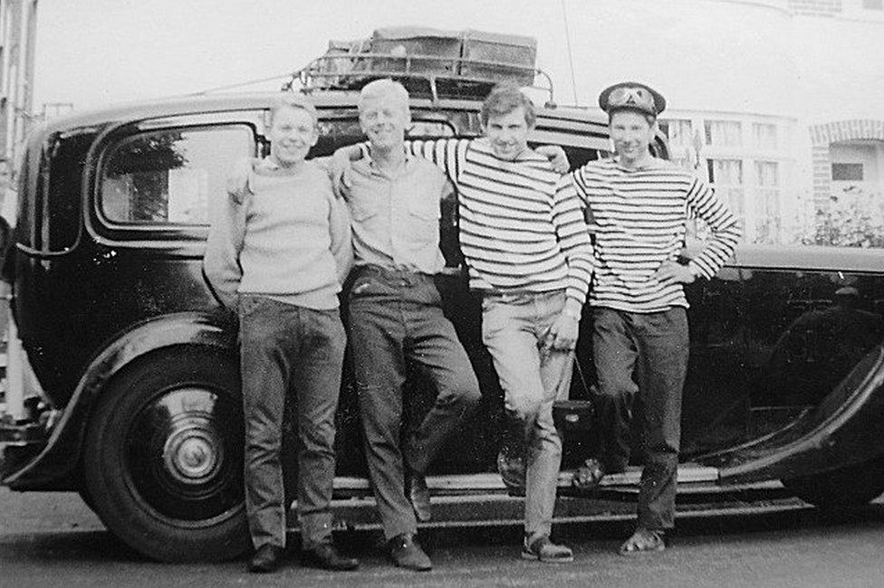 Group of friends and the 1935 Daimler limousine they drove to Rome and back