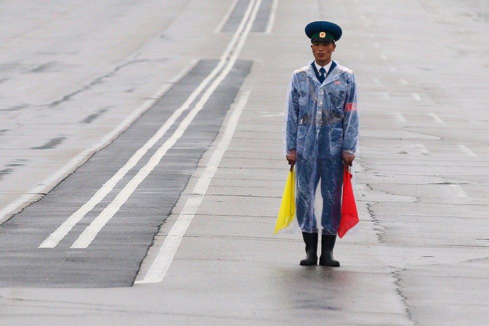 A policeman controls traffic on the road next to the venue of a ruling party congress in Pyongyang, North Korea 6 May 2016