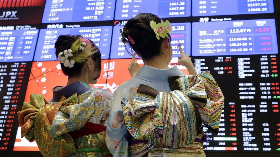 Staff at the Tokyo Stock Exchange