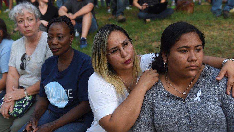 Mourners gather at a vigil after seven people were killed and at least 222 injured in a mass shooting in Texas