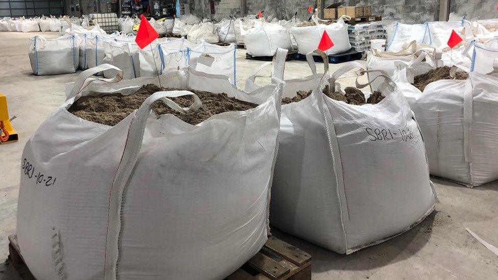 Bags of rocks at lithium plant