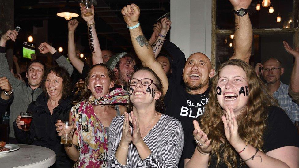 New Zealand fans in Wellington celebrate as they watch the All Blacks win the 2015 Rugby World Cup