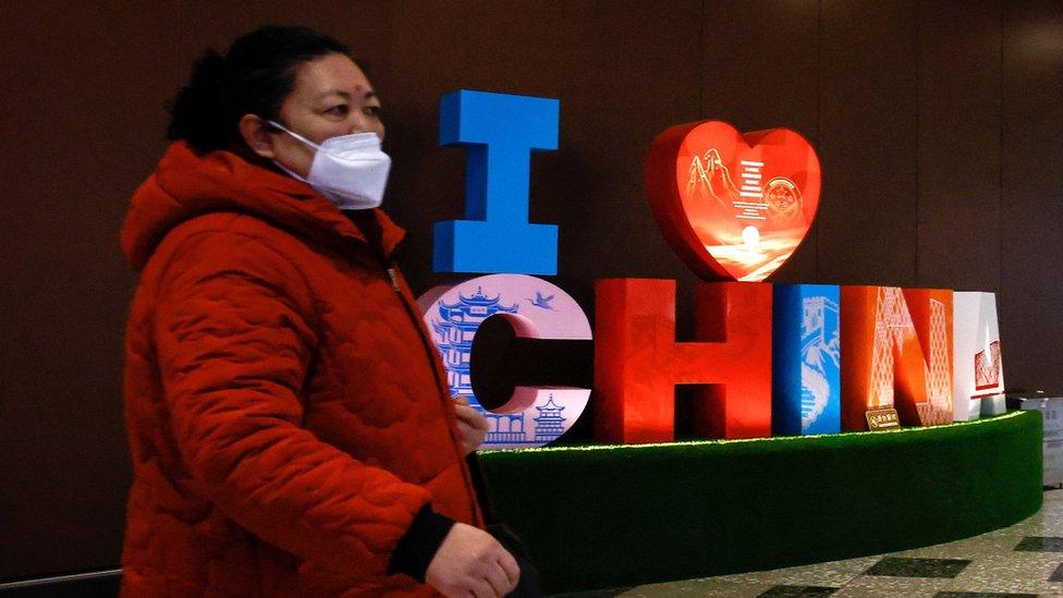 Woman walks through Beijing Daxing International Airport in Beijing