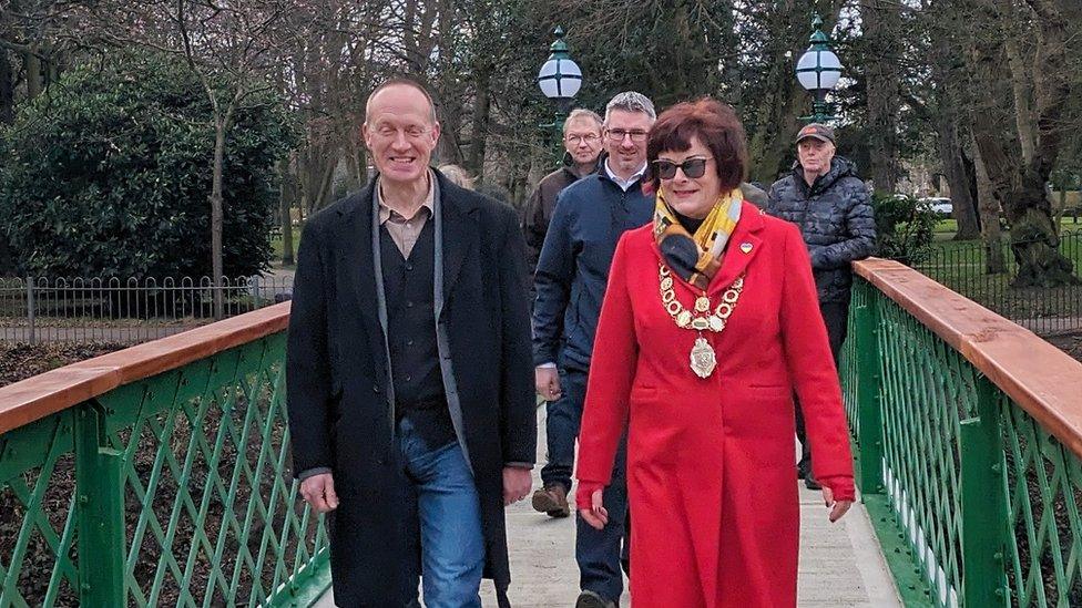 Mayor of Lowestoft Sonia Barker and other people crossing a bridge