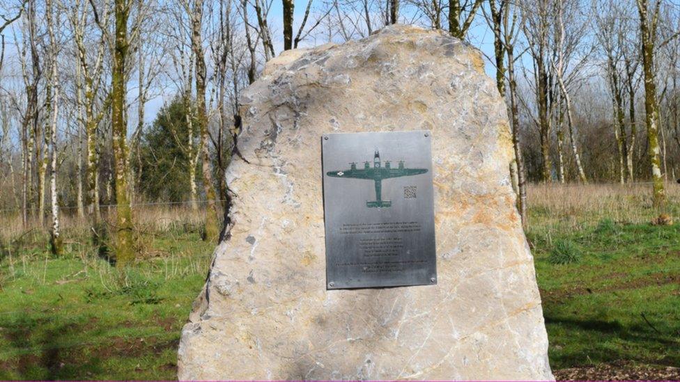 The new plaque honouring the crew of the US bomber who died at Blagdon, with a plane in the centre