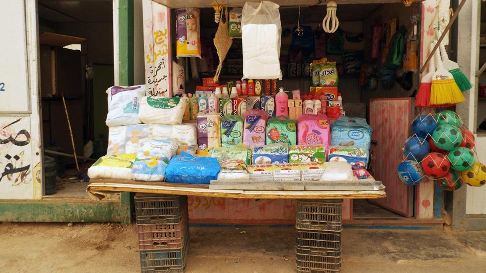 a kiosk selling sanitary products on Zaatari's Champs Elysees