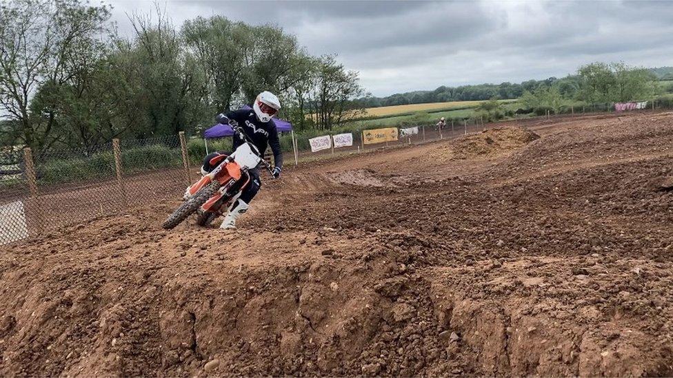 Ki New doing motocross