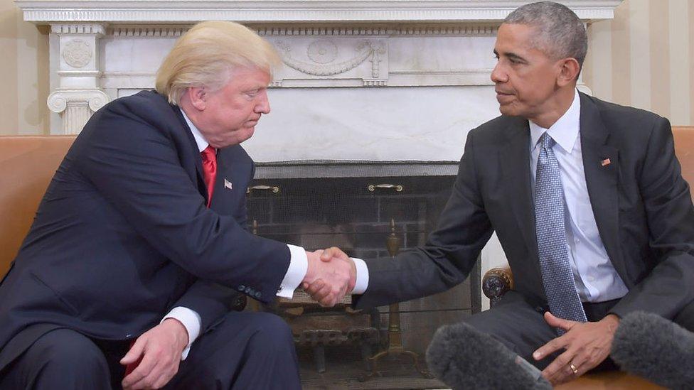 Donald Trump and Barack Obama shake hands in the White House