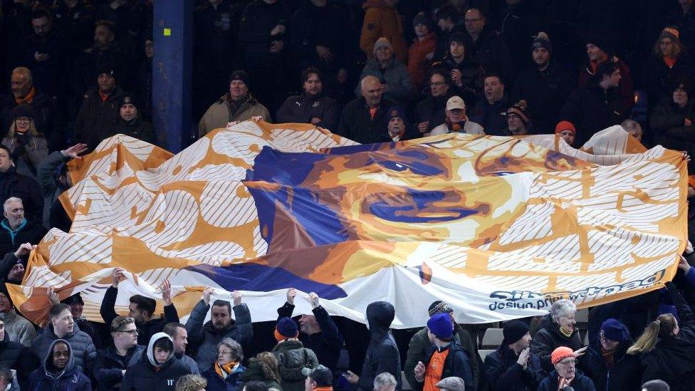 A banner for Tom Lockyer at Kenilworth Road