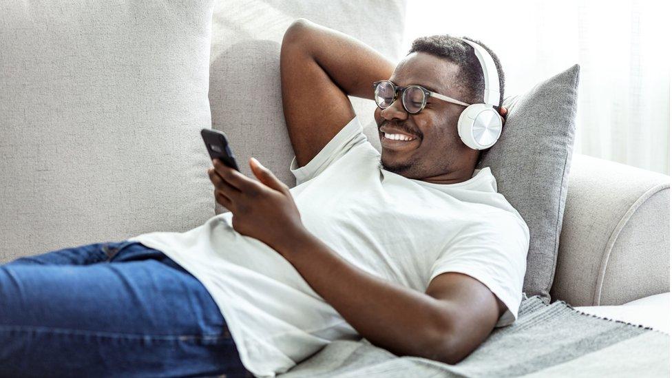 A man watching a video on a smartphone